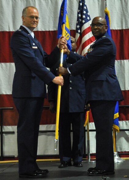Col. Marshall Irvin, 94th Mission Support Group commander, passes a guidon to Col. Steven Parker, 94th Airlift Wing commander, at Dobbins Air Reserve Base, Ga. Jan 9, 2016. Irvin relinquished command of the 94th MSG, symbolized by the passing of the guidon to the commander of the wing. (U.S. Air Force photo/Senior Airman Miles Wilson)