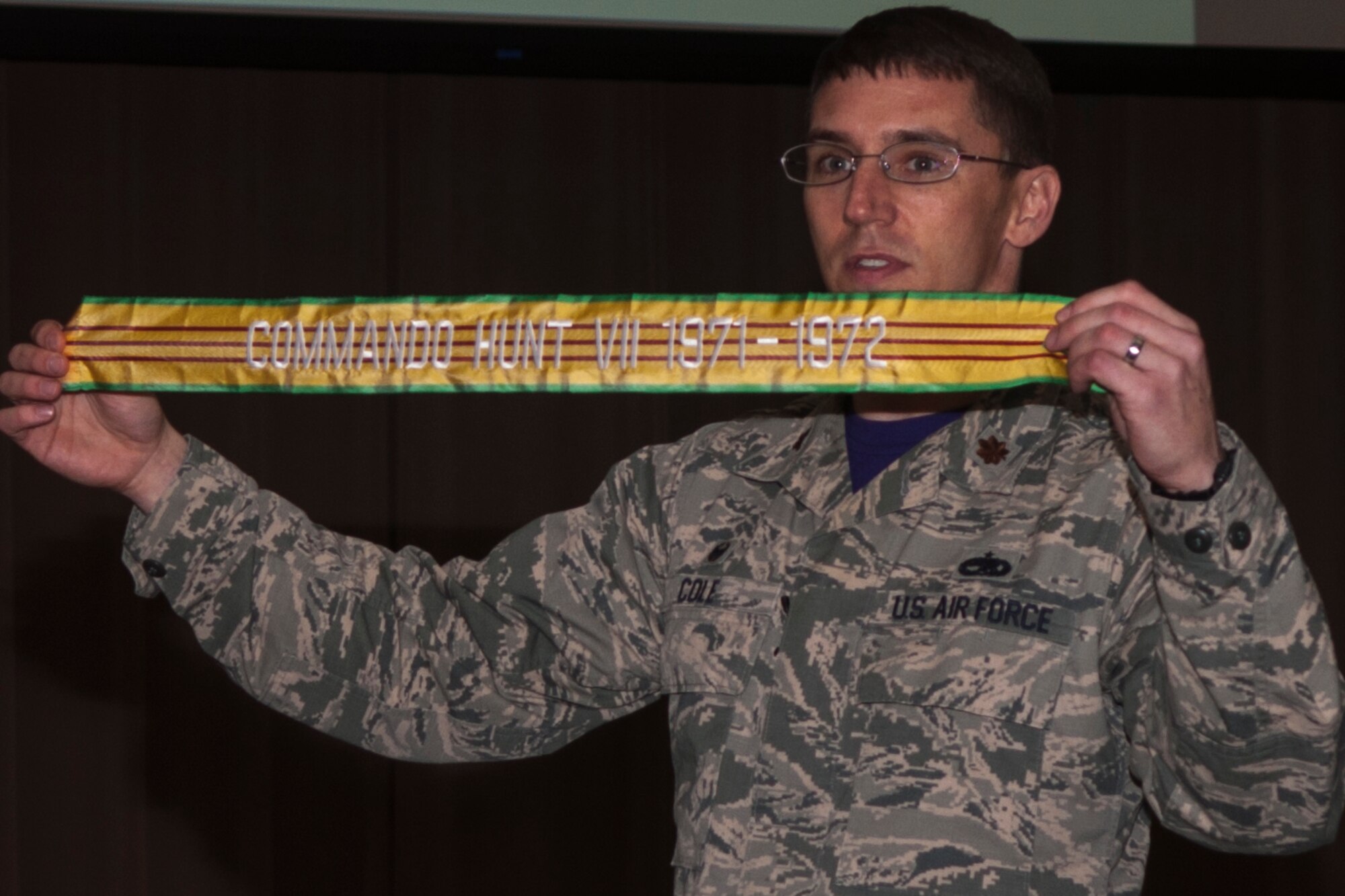 U.S. Air Force Maj. George P. Cole III, the 307th Maintenance Squadron commander, presents a guidon streamer to the Airmen of his squadron. This streamer will be is the first of many that will show the history and heritage of the squadron. (U.S. Air Force photo by Senior Airman Callie Ware/Released)