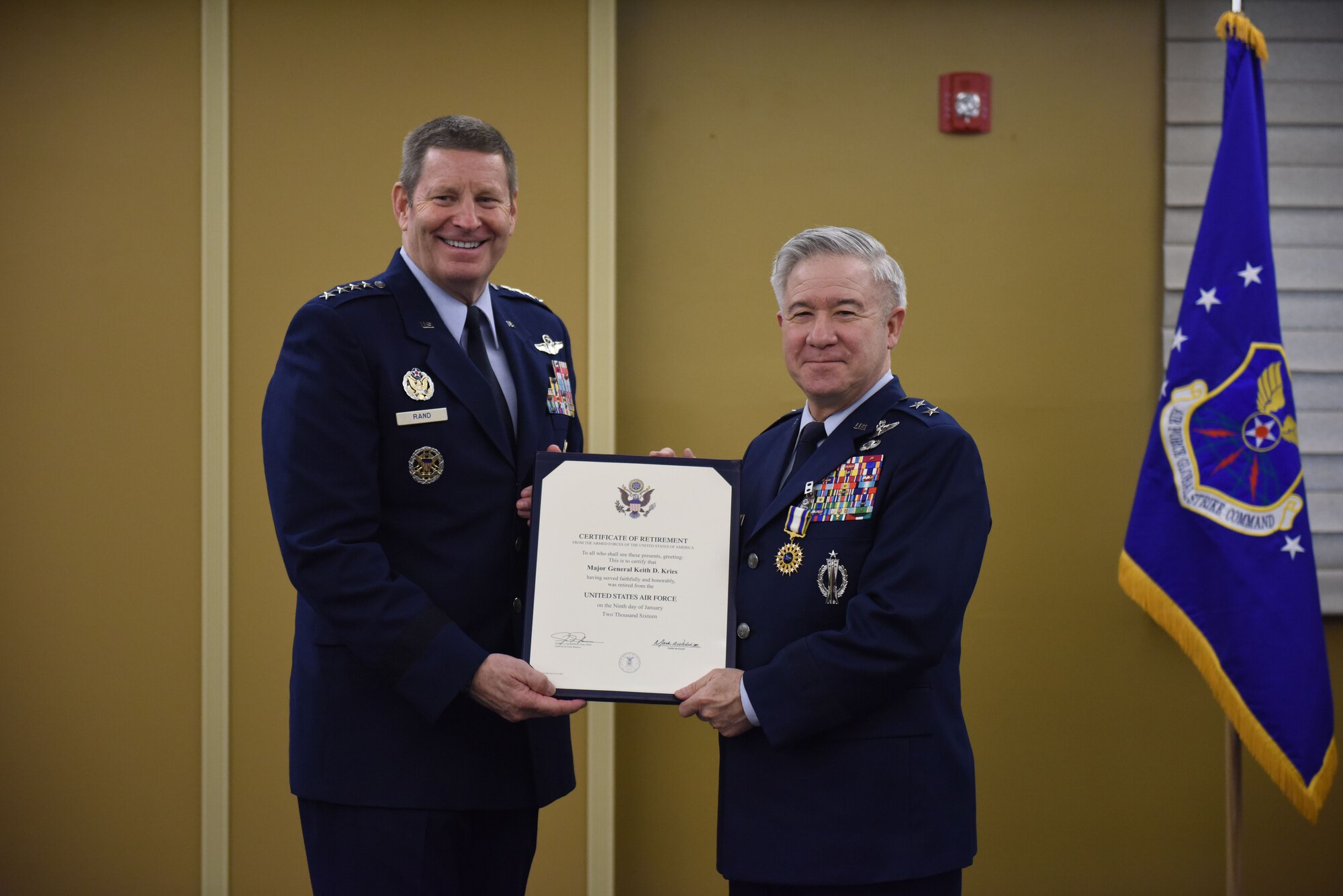 Gen. Robin Rand, Air Force Global Strike Commander, presents a certificate of retirement from the President of the United States to Maj. Gen. Keith D. Kries, during his retirement ceremony, Jan. 9, 2016 at the Pittsburgh International Airport Air Reserve Station. Kries retired from the Air Force Reserve after 41 years of military service, most recently serving in the role of mobilization assistant to the Commander, Air Force Global Strike Command. (U.S. Air Force photo by Staff Sgt. Brandy L. Grace)