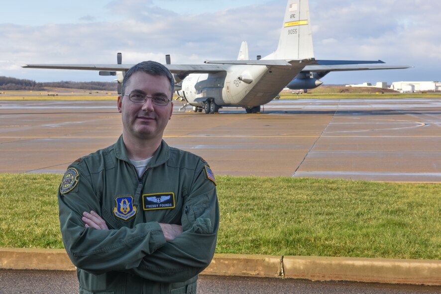 Maj. Fred Pounds, flight commander of clinical management with the 911th Aeromedical Evacuation Squadron, stands in front of a C-130 Hercules at the Pittsburgh International Airport Air Reserve Station, Jan. 9, 2016. Pounds helped to save a woman’s life during a Yellow Ribbon Event in Orlando, Florida, in December. (U.S. Air Force photo by Senior Airman Marjorie A. Bowlden)