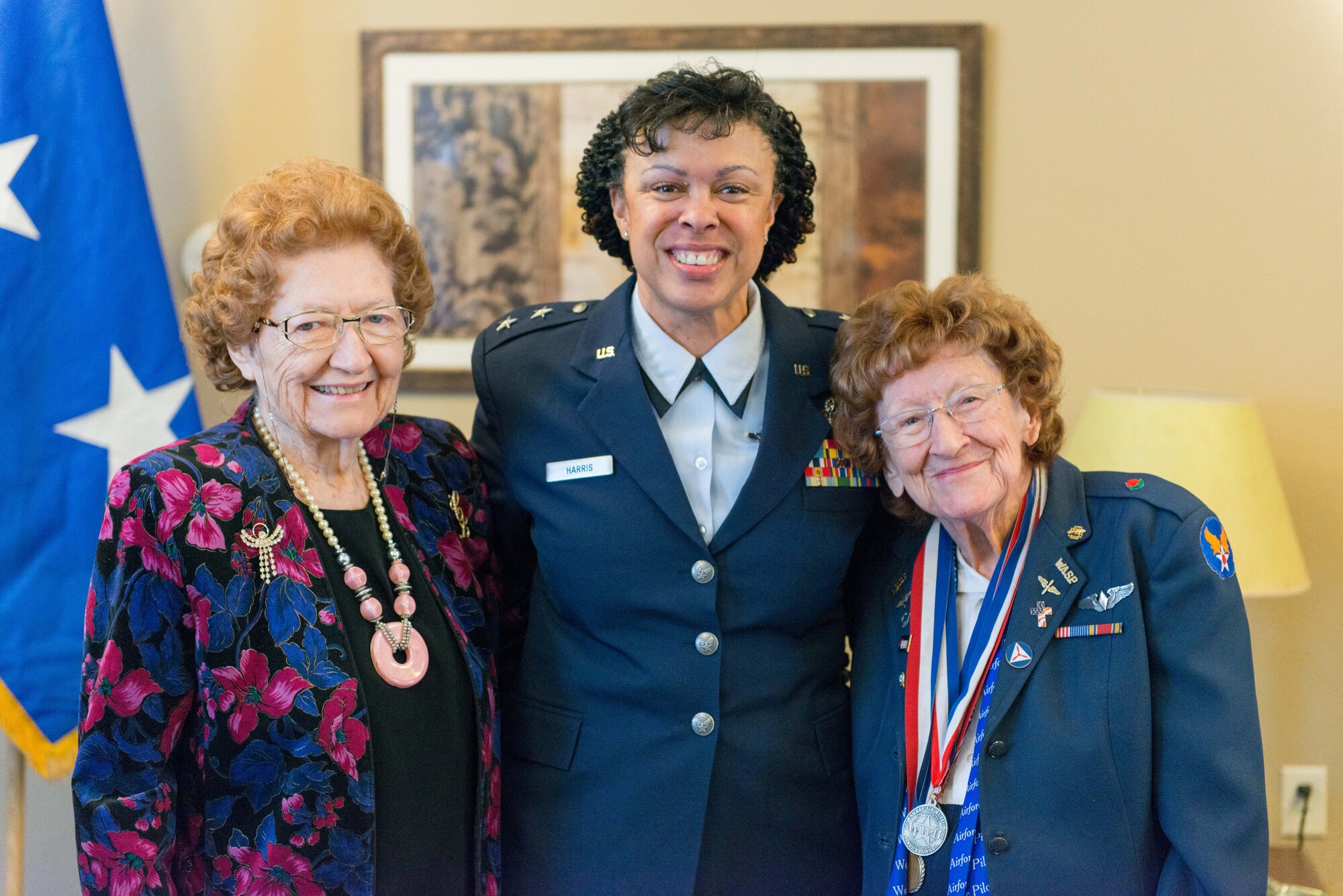 Ms. Cecelia Bell (left), Maj. Gen. Stayce Harris, 22nd Air Force commander (center), and Betty Strohfus (right) pose at the Congressional Gold Medal Ceremony in Faribault, Minn. on Jan. 7.  Ms. Bell was presented with the Congressional Gold Medal for her service in the Civil Air Patrol during World War II. (U.S. Air Force photo by Captain William-Joseph Mojica)