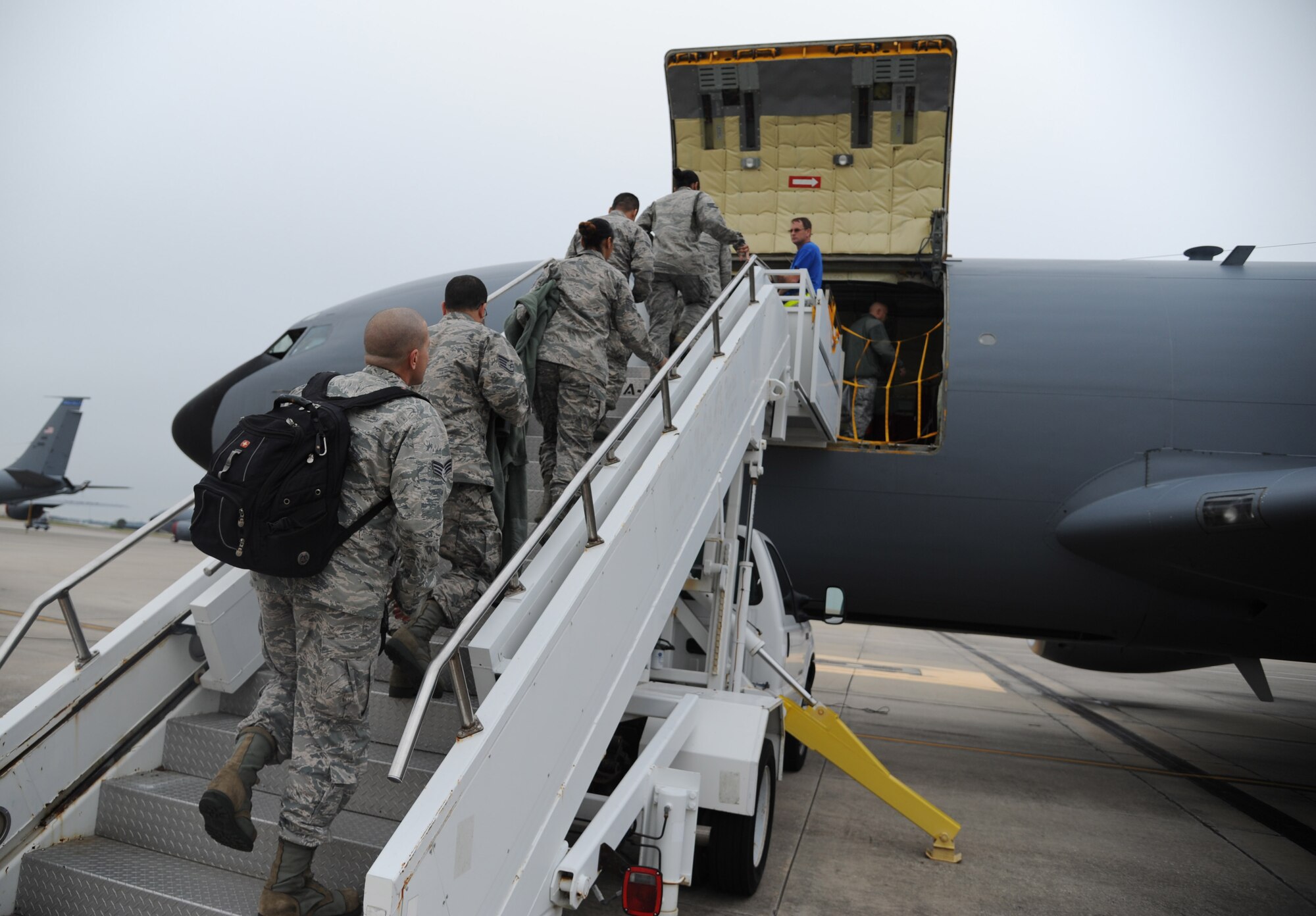Members of the 927th Air Refueling Wing board a KC-135 Stratotanker to fly during an incentive flight on Jan. 9, 2016. The flight was to acknowledge Airmen for their work around the wing.  (U.S. Air Force photo by Senior Airman Xavier Lockley)