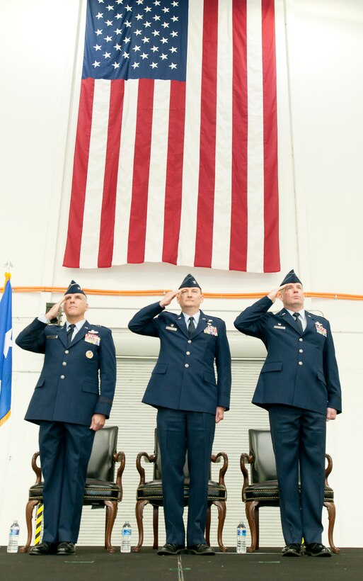 Joint Base Andrews, Md. – From left to right: Maj. Gen. John C. Flournoy Jr., commander, 4th Air Force; Col. Thomas “TK” Smith; and Col. David A. Owens Jr., 459th Air Refueling Wing commander, render salutes during the change of command ceremony here Jan. 10, 2016. Owens took command of the 459 ARW from Smith during the ceremony. (U.S. Air Force photo/Senior Airman Kristin Kurtz)