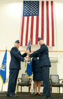 JOINT BASE ANDREWS, Md. -- Maj. Gen. John C. Flournoy Jr. (left), 4th Air Force commander, passes the 459th Air Refueling Wing guidon to Col. David A. Owens (right) during the change of command ceremony here Jan. 10. Owens took command of the 459 ARW from Col. Thomas “TK” Smith Jr. (U.S. Air Force photo/Senior Airman Kristin Kurtz)