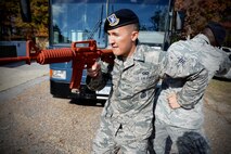Senior Airman Justin Goyette, 459th Security Forces Squadron member, practices back-to-back tactic maneuvering during Expeditionary Active Shooter Training Nov. 7, 2015. The class, which began in October 2015, is a two-tier level training for all deploying Airmen. (U.S. Air Force photo by Chief Master Sgt. Dale Canofari)