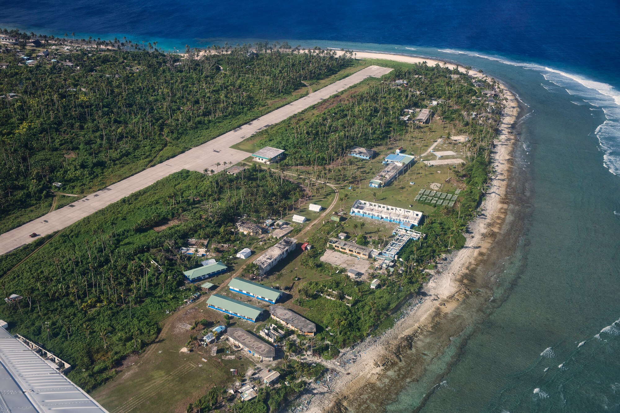 Aerial image of Falalop airfield and outer island high school, Falalop Island, Ulithi Atoll, Federated States of Micronesia, Dec. 7, 2015. The high school was severely damaged by Typhoon Maysak, a storm that intensified into the equivalent of a Category 5 hurricane with maximum sustained winds of 160 mph in March 2015. (U.S. Air Force photo by Osakabe Yasuo/Released)