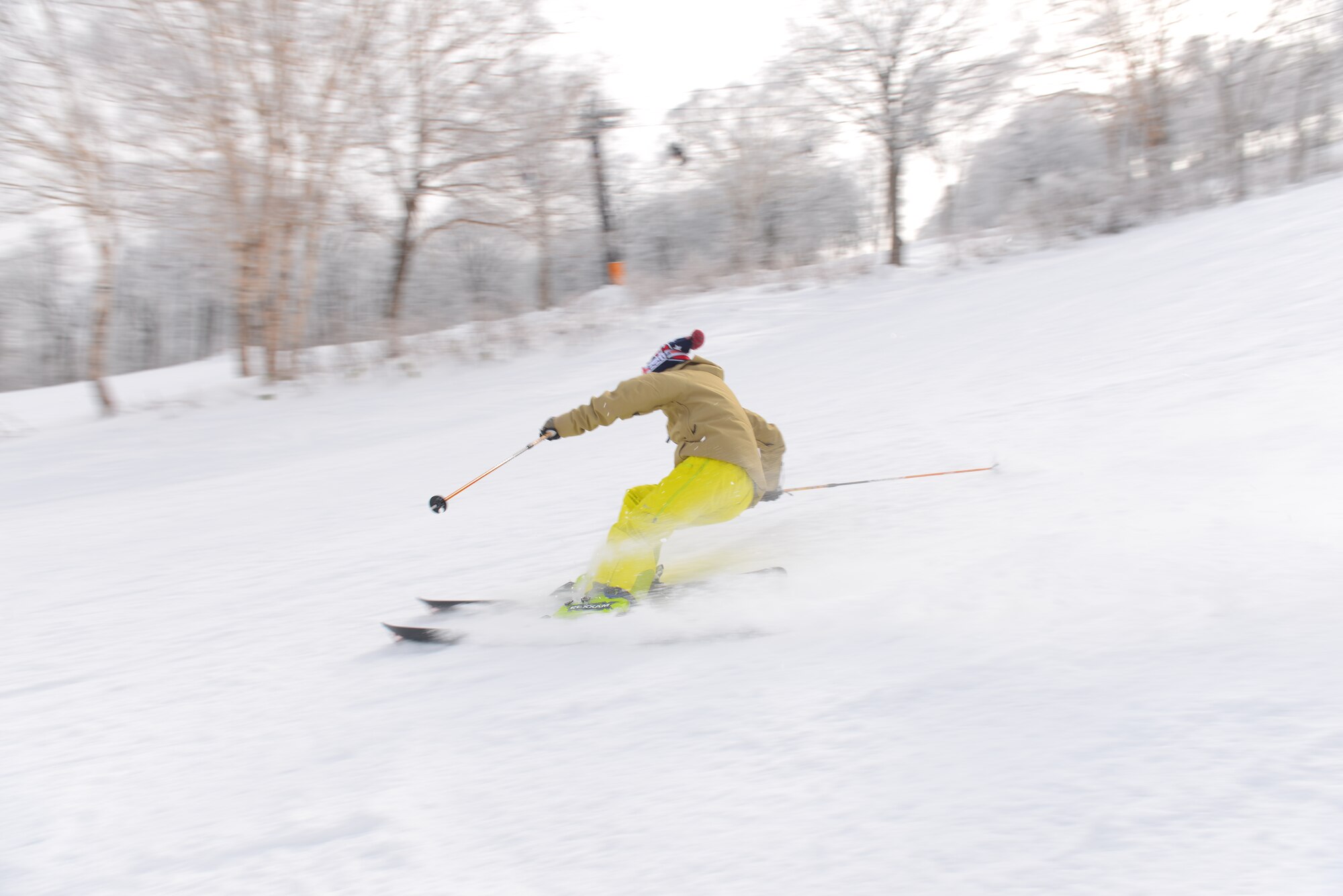 Juni Kunimatsu, 374th Force Support Squadron Outdoor Recreation specialist, skis down the red slope at Nozawa Onsen, Japan, Jan. 6, 2016. Outdoor Recreation provides Yokota personnel and their families with the opportunity to enjoy a variety of outdoor activities, including rock climbing, guided tours and ski and snowboarding trips. (U.S. Air Force photo by Airman 1st Class Elizabeth Baker/Released)