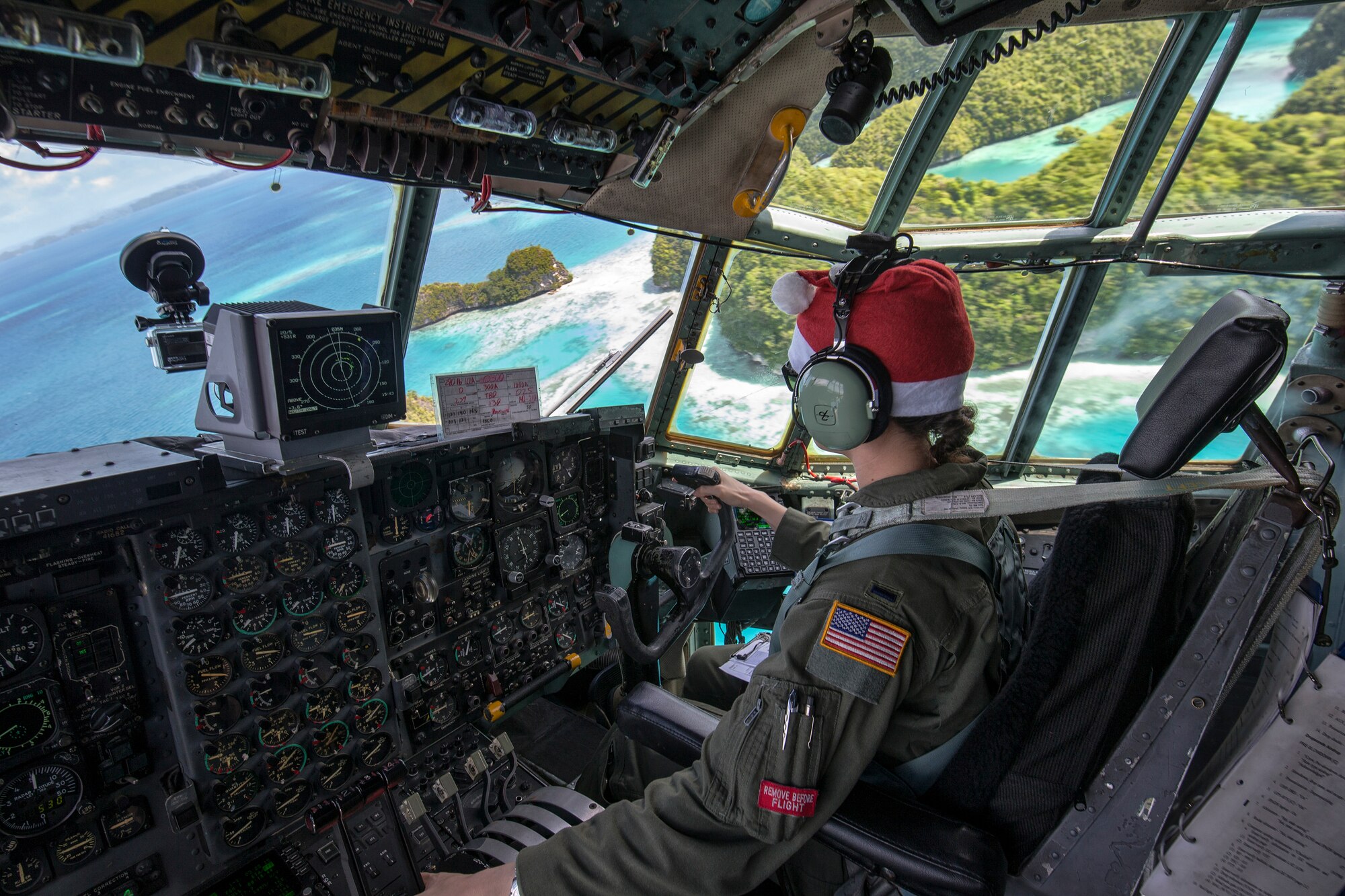 1st Lt. Sydney Croxton, 36th Airlift Squadron C-130 pilot, flies over Republic of Palau, Dec. 11, 2015, during Operation Christmas Drop. This year marks the 64th year of Operation Christmas Drop, which began in 1952, and is the first trilateral execution of the event with support from Japan Air Self-Defense Force and Royal Australian Air Force C-130s. (U.S. Air Force photo by Osakabe Yasuo/Released)
 
