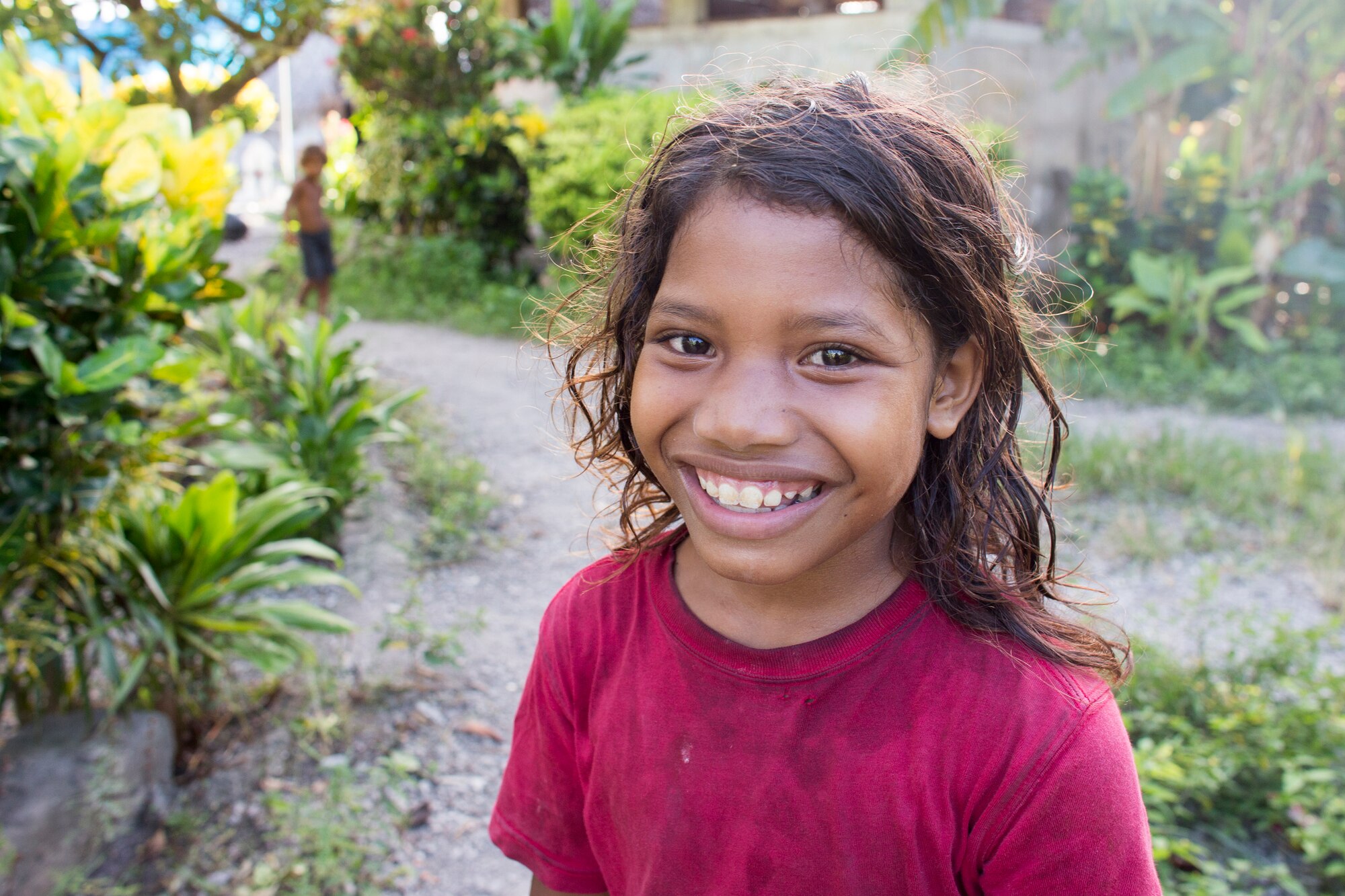 A island child smiles in anticipation of gifts during Operation Christmas Drop at Fais Island, Federated States of Micronesia, Dec. 8, 2015. A C-130 Hercules from the 36th Airlift Squadron delivered more than 800 pounds of supplies to Fais island during Operation Christmas Drop 2015. This year marks the first trilateral execution that includes air support from the Japan Air-Self Defense Force and the Royal Australian Air Force. (U.S. Air Force photo by Osakabe Yasuo/Released)
 

