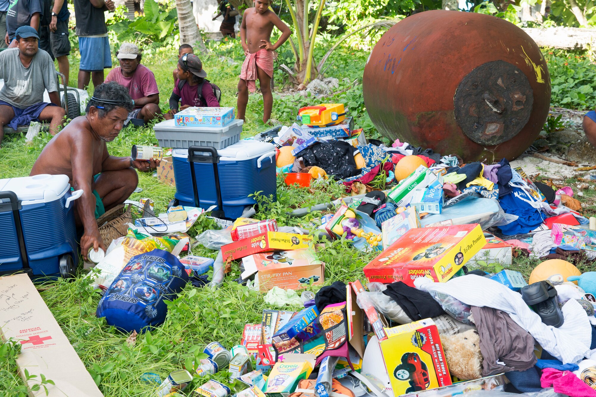 Louis Mangtau, Chief of Fais Island, sorts through supplies that were dropped during Operation Christmas Drop 2015, Dec. 8, 2015, at Fais Island, Federated States of Micronesia. Operation Christmas Drop is a humanitarian/disaster relief training event where C-130 crews provide critical supplies to 56 islands throughout the Commonwealth of the Northern Marianas, Federated States of Micronesia and Republic of Palau. This year marks the first ever trilateral execution that includes air support from the U.S. Air Force, Japan Air Self-Defense Force and the Royal Australian Air Force. (U.S. Air Force photo by Osakabe Yasuo/Released)
 
