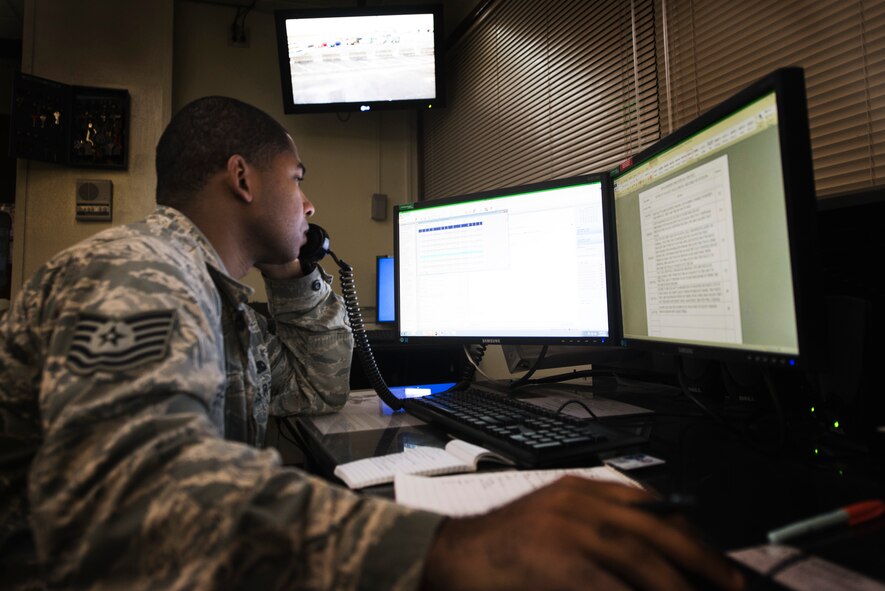U.S. Air Force Tech. Sgt. Christopher Clarke, 18th Wing Command Post senior controller, tracks inbound and outbound Air Mobility Command missions Jan. 11, 2016, at Kadena Air Base, Japan. The 18th Wing Command Post supports the wing commander and disseminates information to the installation. (U.S. Air Force photo by Senior Airman Omari Bernard)