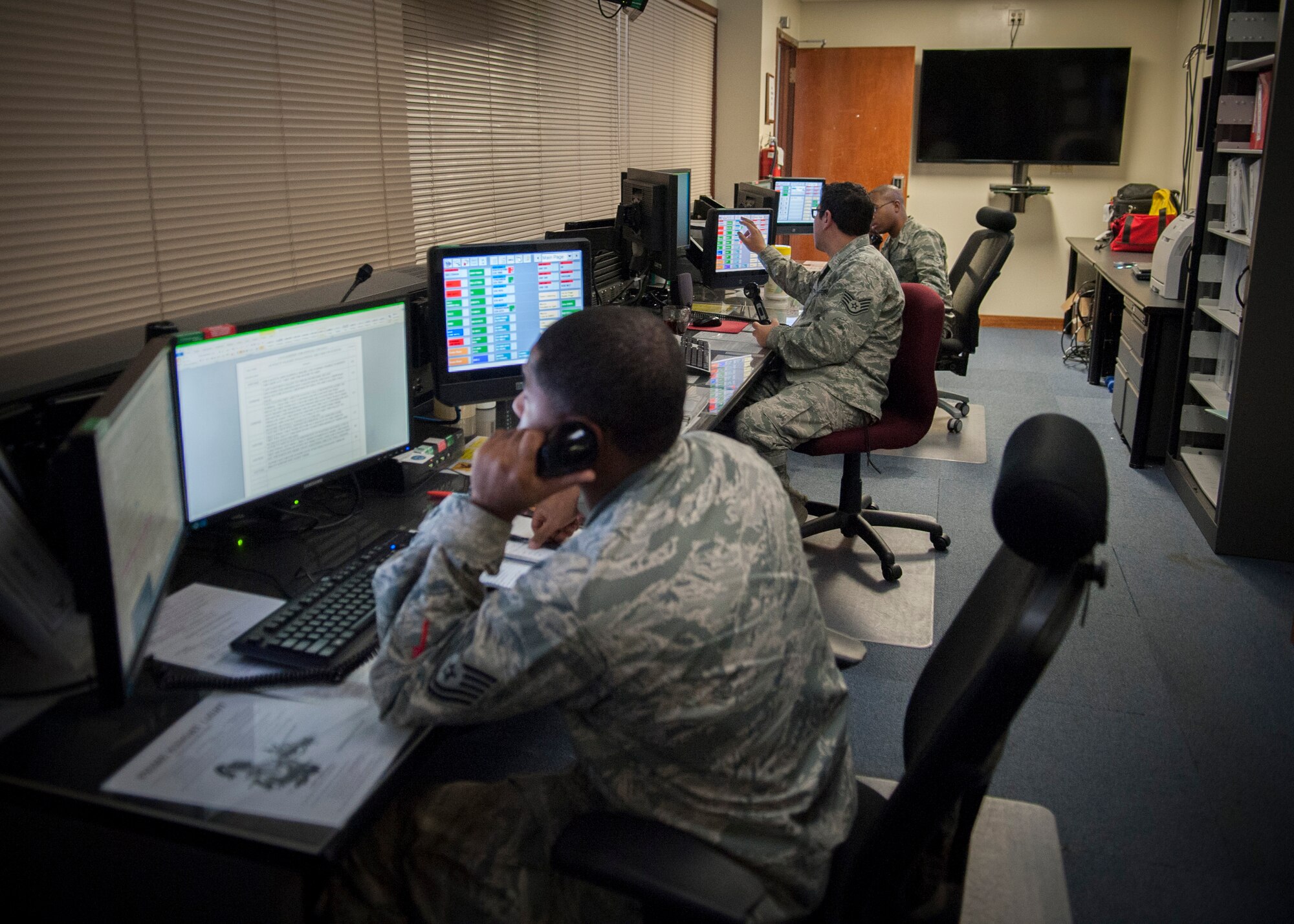 Controllers assigned to the 18th Wing Command Post track inbound and outbound transient flying missions Jan. 11, 2016, at Kadena Air Base, Japan. Command Post controllers support the wing commander by disseminating information to base personnel as well as reporting to higher headquarters such as U.S. Forces Japan, 5th Air Force and Pacific Air Forces. (U.S. Air Force photo by Master Sgt. Jason W. Edwards)