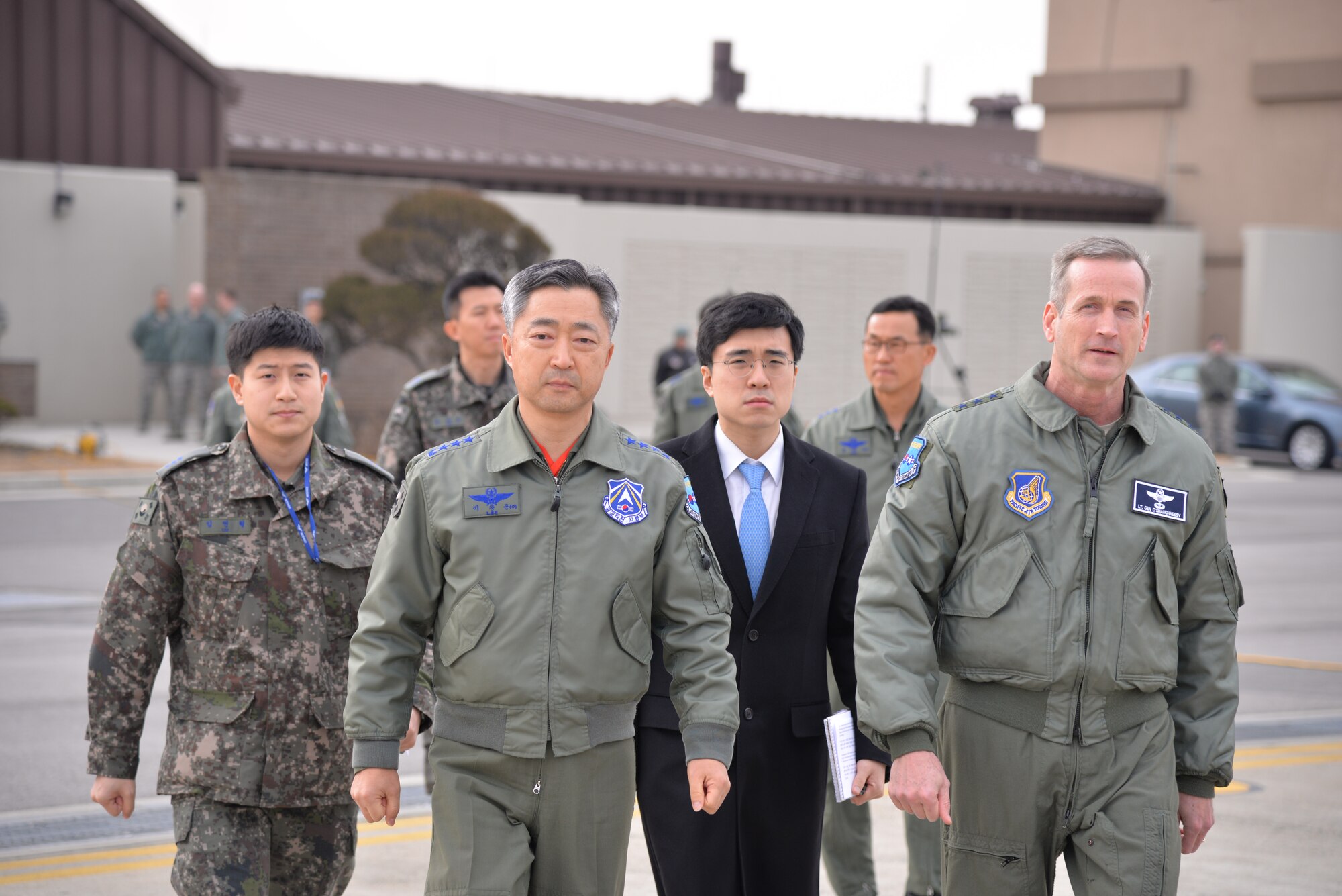 OSAN AIR BASE, Republic of Korea - United Nations Command, U.S. Forces Korea deputy commander and U.S. 7th Air Force commander, Lt. Gen. Terrence O'Shaughnessy (right) and Lt. Gen. Wang-keon Lee, ROK Air Force Operations Command commander (left), walk toward the podiums before speaking to Korean and international media at Osan Air Base, South Korea, Jan. 10, 2016, prior to a low-level pass from a U.S. Air Force B-52 Stratofortress in response to recent provocative action by North Korea. The B-52 was joined by a ROKAF F-15 Slam Eagle and a U.S. Air Force F-16 Fighting Falcon.  The B-52 is a is a long-range, heavy bomber that can fly up to 50,000 feet and has the capability to carry 70,000 pounds of nuclear or precision guided conventional ordnance with worldwide precision navigation capability. (U.S. Air Force photo/Staff Sgt. Benjamin Sutton)