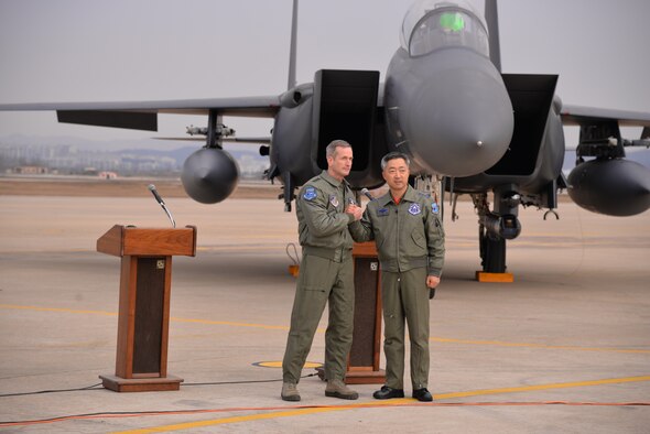 OSAN AIR BASE, Republic of Korea - United Nations Command, U.S. Forces Korea deputy commander and U.S. 7th Air Force commander, Lt. Gen. Terrence O'Shaughnessy (right) and Lt. Gen. Wang-keon Lee, ROK Air Force Operations Command commander (left), speak to Korean and international media at Osan Air Base, South Korea, Jan. 10, 2016, prior to a low-level pass from a U.S. Air Force B-52 Stratofortress in response to recent provocative action by North Korea. The B-52 was joined by a ROKAF F-15 Slam Eagle and a U.S. Air Force F-16 Fighting Falcon.  The B-52 is a is a long-range, heavy bomber that can fly up to 50,000 feet and has the capability to carry 70,000 pounds of nuclear or precision guided conventional ordnance with worldwide precision navigation capability. (U.S. Air Force photo/Staff Sgt. Benjamin Sutton)