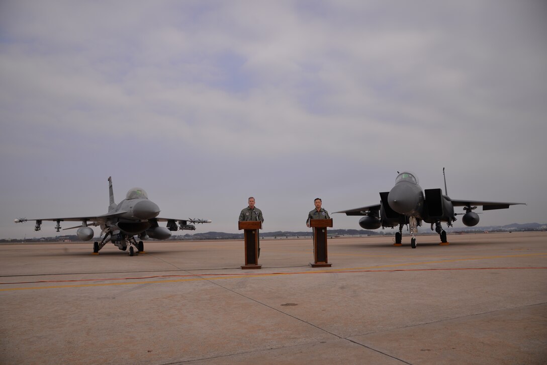OSAN AIR BASE, Republic of Korea - United Nations Command, U.S. Forces Korea deputy commander and U.S. 7th Air Force commander, Lt. Gen. Terrence O'Shaughnessy (right) and Lt. Gen. Wang-keon Lee, ROK Air Force Operations Command commander (left), speak to Korean and international media at Osan Air Base, South Korea, Jan. 10, 2016, prior to a low-level pass from a U.S. Air Force B-52 Stratofortress in response to recent provocative action by North Korea. The B-52 was joined by a ROKAF F-15 Slam Eagle and a U.S. Air Force F-16 Fighting Falcon.  The B-52 is a is a long-range, heavy bomber that can fly up to 50,000 feet and has the capability to carry 70,000 pounds of nuclear or precision guided conventional ordnance with worldwide precision navigation capability. (U.S. Air Force photo/Staff Sgt. Benjamin Sutton)