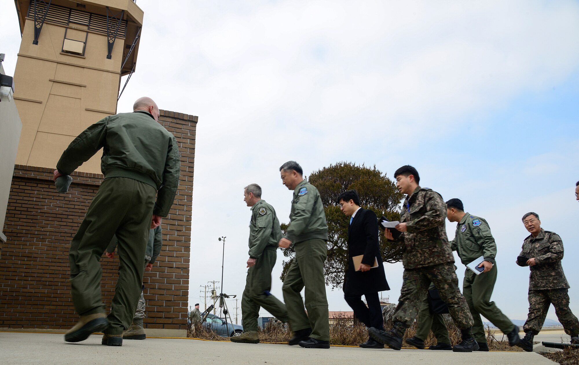 United Nations Command, U.S. Forces Korea deputy commander and U.S. 7th Air Force commander, Lt. Gen. Terrence O'Shaughnessy, Lt. Gen. Wang-keon Lee, ROK Air Force Operations Command commander, and members of the U.S. and ROK Air Forces prepare to watch a low-level pass from a U.S. Air Force B-52 Stratofortress, from Andersen Air Force Base, Guam, in response to recent provocative action by North Korea in the vicinity of Osan Air Base, South Korea, Jan 10, 2016. The combined mission demonstrates the strength of the alliance between the U.S. and ROK and the resolve of both nations to maintain stability and security on the peninsula. (U.S. Air Force photo/Senior Airman Kristin High)