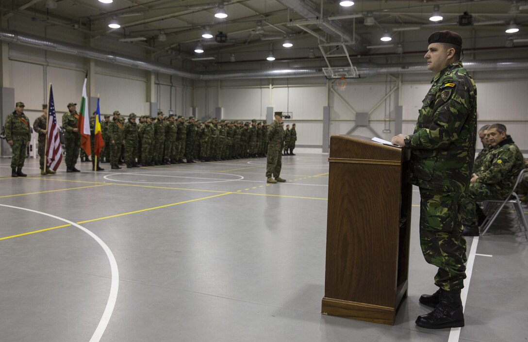Marines with the Combined Arms Company, Black Sea Rotational Force, Bulgarian and Romanian Forces mark the beginning to Platinum Lion 16.2 on Novo Selo Training Area, Bulgaria, Jan. 7, 2016. Exercise Platinum Lion increases readiness and demonstrates our collective ability to operate as a single force committed to protecting the sovereignty of NATO allies and other European partners. (U.S. Marine Corps Photo by Cpl. Justin T. Updegraff/ Released)