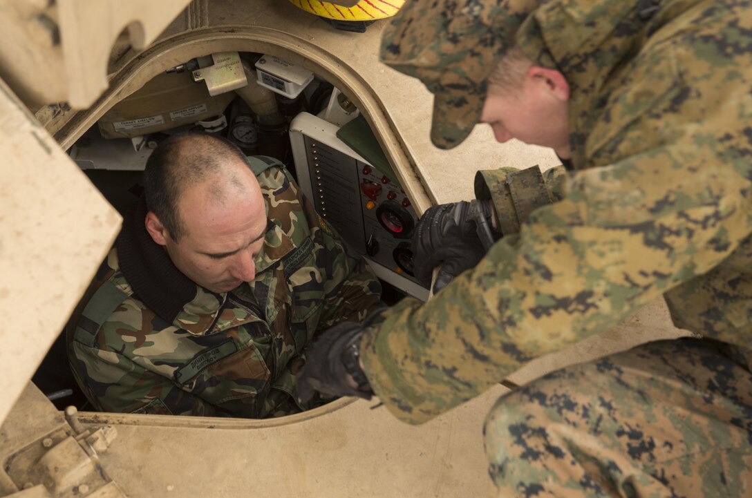 Marines with the Combined Arms Company, Black Sea Rotational Force, Bulgarian and Romanian Forces spent the afternoon getting hands on with the vehicles and weapons each country has brought to Platinum Lion 16.2 on Novo Selo Training Area, Bulgaria, Jan. 7, 2016. Platinum Lion is designed to increase collective capabilities and demonstrates our collective ability to operate as a single force committed to protecting the sovereignty of NATO allies and other European partners. (U.S. Marine Corps Photo by Cpl. Justin T. Updegraff/ Released)