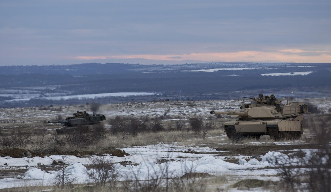 U.S. Marine M1A1 Abrams tanks and Bulgarian T-72 tanks conduct maneuver training during Platinum Lion 16-2 at Novo Selo Training Area, Bulgaria, Jan. 8, 2016. Exercise Platinum Lion provides combined training with NATO Allies and partners, demonstrating our commitment to promoting a peaceful and stable Europe through theatre security cooperation engagements. (U.S. Marine Corps Photo by Cpl. Justin T. Updegraff/ Released)