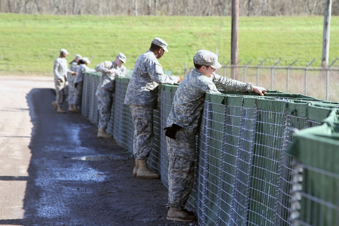 Soldiers secure HESCO barriers for flood protection in support of Operation Winter River Flooding, Jan. 9, 2016. Louisiana Army National Guard photo by Spc. Tarell J. Bilbo