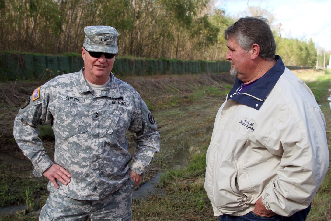 Army Maj. Gen. Glenn H. Curtis, left, adjutant general of the Louisiana National Guard talks with Carroll B. Snyder, mayor of Krotz Springs, while soldiers worked with community volunteers and the Department of Transportation and Development to build protective flood barriers in advance of expected river flooding in support of Operation Winter River Flooding, Jan. 9, 2016. Louisiana Army National Guard photo by Spc. Tarell J. Bilbo