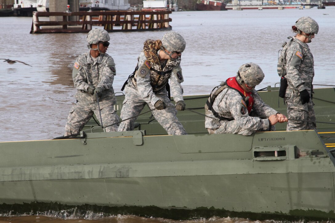 Soldiers assemble an improved ribbon bridge in Amelia, La., to transport crew, equipment and supplies to build a 12,550-linear-foot levee on Avoca Island in advance of expected river flooding in Morgan City, La., Jan. 8, 2016. Louisiana Army National Guard photo by Spc. Garrett Dipuma
