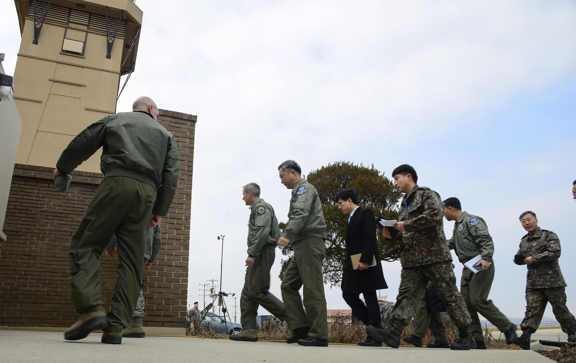 Lt. Gen. Terrence O'Shaughnessy, the deputy commander of United Nations Command Korea and commander of the U.S. 7th Air Force; Lt. Gen. Wang-keon Lee, the South Korean Air Force Operations Command commander; and members of the U.S. and South Korean air forces prepare to watch a low-level pass from a U.S. Air Force B-52 Stratofortress from Andersen Air Force Base, Guam, in response to recent provocative action by North Korea in the vicinity of Osan Air Base, South Korea, Jan 10, 2016. (U.S. Air Force photo/Senior Airman Kristin High)