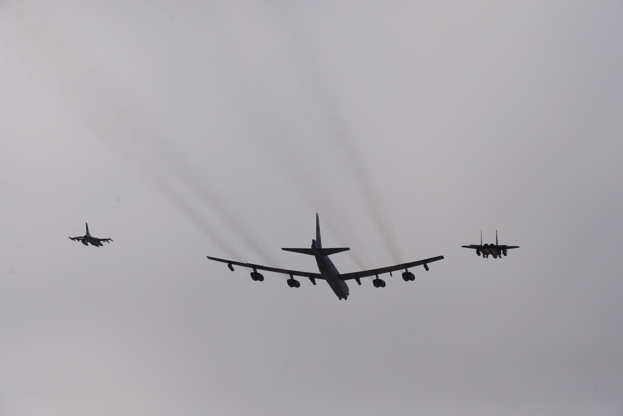 A U.S. Air Force B-52 Stratofortress from Andersen Air Force Base, Guam, conducted a low-level flight in the vicinity of Osan, South Korea, in response to recent provocative action by North Korea Jan. 10, 2016. The B-52 was joined by a South Korean F-15 Slam Eagle and a U.S. Air Force F-16 Fighting Falcon. The B-52 is a long-range, heavy bomber that can fly up to 50,000 feet and has the capability to carry 70,000 pounds of nuclear or precision guided conventional ordnance with worldwide precision navigation capability. (U.S. Air Force photo/Staff Sgt. Amber Grimm)