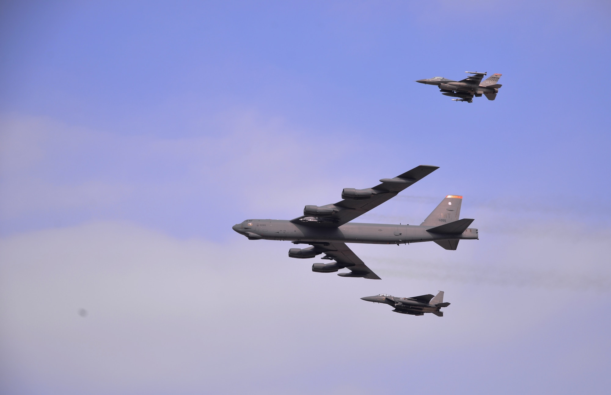 A U.S. Air Force B-52 Stratofortress from Andersen Air Force Base, Guam, conducted a low-level flight in the vicinity of Osan Air Base, South Korea, in response to recent provocative action by North Korea Jan. 10, 2016. The B-52 was joined by a South Korean F-15K Slam Eagle and a U.S. Air Force F-16 Fighting Falcon. The B-52 is a long-range, heavy bomber that can fly up to 50,000 feet and has the capability to carry 70,000 pounds of nuclear or precision guided conventional ordnance with worldwide precision navigation capability. (U.S. Air Force photo/Staff Sgt. Benjamin Sutton)