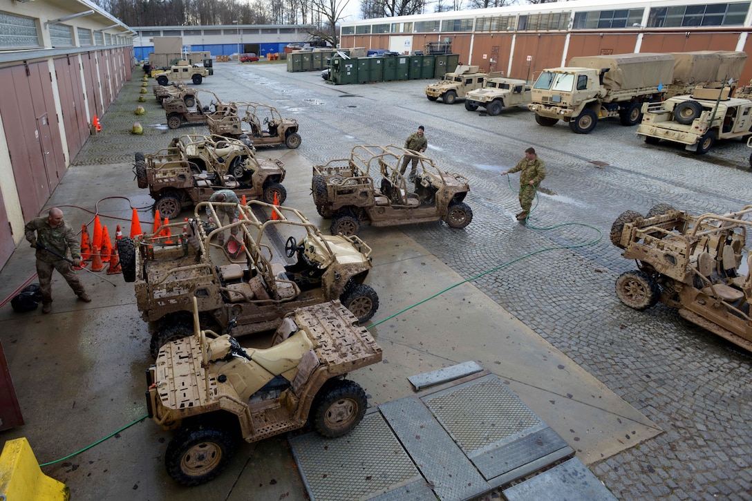 U.S. Soldiers spray down and clean up several MRZR4 LT-All Terrain Vehicles after testing their capabilities in the Boeblingen Local Training Area, Germany, Jan. 5, 2016. U.S. Army photo by Jason Johnston