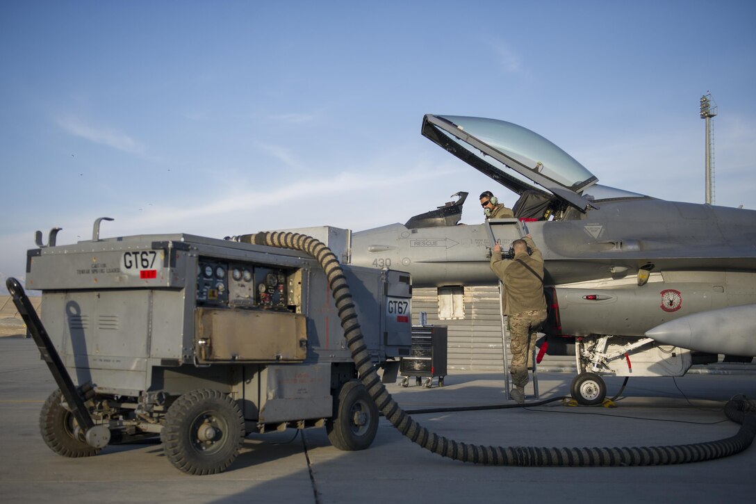 U.S. Air Force Tech. Sgt. Ritchie Videna, cockpit, and Staff Sgt. Matthew Crabtree perform a chaff and flare operations check on an F-16 Fighting Falcon aircraft on Bagram Airfield, Afghanistan, Jan. 8. 2016. Videna and Crabtree are avionics systems technicians assigned to the 455th Expeditionary Aircraft Maintenance Squadron, deployed from Hill Air Force Base, Utah. U.S. Air Force photo by Tech. Sgt. Robert Cloys