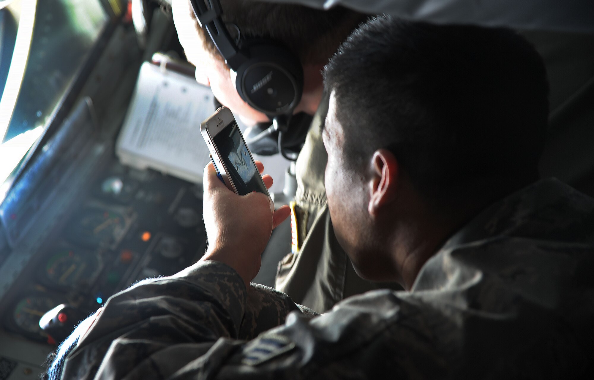 Senior Airman Caleb Seitz, 927th Aircraft Maintenance Squadron technician, takes a photo onboard during an incentive flight on Jan. 9, 2016 at MacDill Air Force Base, Fla. The flight was to acknowledge Airmen for their stellar work around the wing. (U.S. Air Force photo by Senior Airman Xavier Lockley) 

