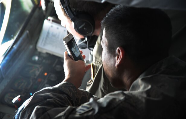 Senior Airman Caleb Seitz, 927th Aircraft Maintenance Squadron technician, takes a photo onboard during an incentive flight on Jan. 9, 2016 at MacDill Air Force Base, Fla. The flight was to acknowledge Airmen for their stellar work around the wing. (U.S. Air Force photo by Senior Airman Xavier Lockley) 
