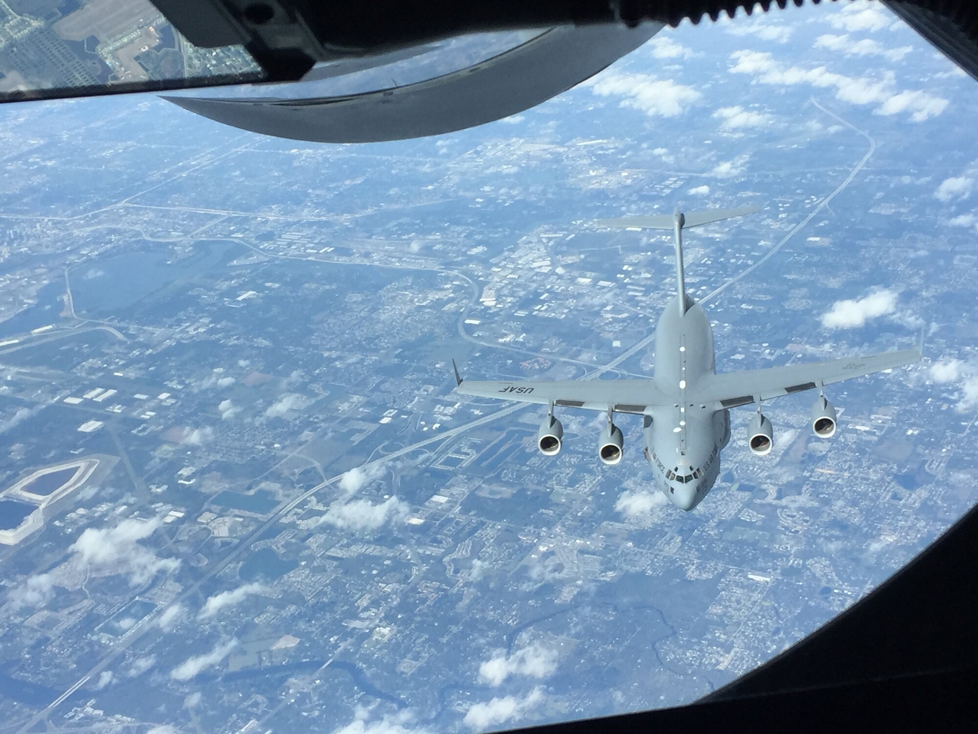 A C-17 Globemaster assigned to the 249th Airlift Squadron with the Alaska Air National Guard,  Joint Base Elmendorf-Richardson, Alaska, approaches a KC-135 Stratotanker to refuel on Jan. 9, 2016 at MacDill Air Force Base, Fla. The flight was an in-air refueling training that gave Airmen further insight to the mission. (Courtesy photo) 
