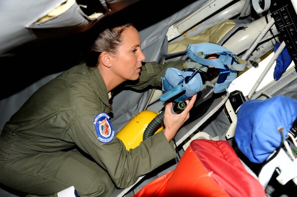 Staff Sgt. Nikki Dover, 63rd Air Refueling Squadron boom operator preps equipment before a flight Jan. 9, 2016 at MacDill Air Force Base, Fla. The flight was to acknowledge Airmen for their stellar work around the wing. (U.S. Air Force photo by Senior Airman Xavier Lockley) 
