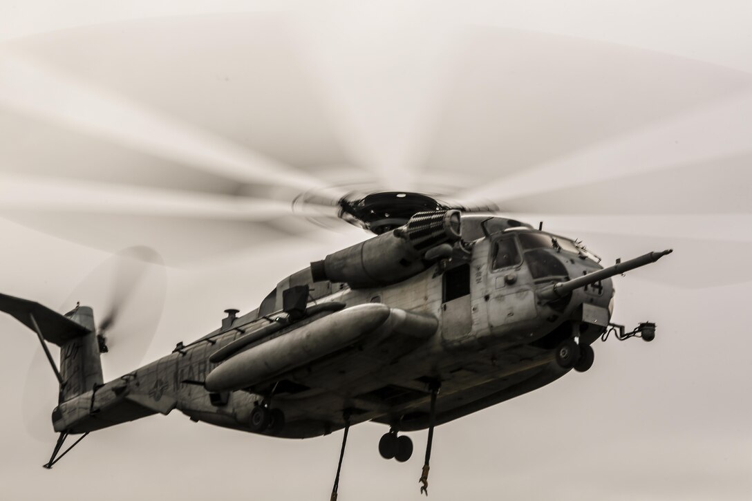CH-53E Super Stallion hovers over the landing zone prior to conducting external lifts in conjunction with Combat Logistics Battalion 2 at Camp Lejeune, N.C., Jan. 6, 2016. The CH-53E is the go to aircraft in the Marine Corps for lifting heavy loads of cargo of up to 16 tons for 50 miles and back. (U.S. Marine Corps photo by Lance Cpl. Erick Galera/Released)