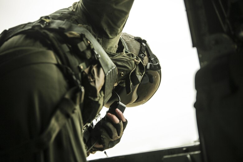 Cpl. Cody Vitols, a crew chief with Marine Heavy Helicopter Squadron 302, prepares to conduct external lifts in conjunction with Combat Logistics Battalion 2 at Camp Lejeune, N.C., Jan. 6, 2016. The crew chief’s responsibilities when conducting external lifts are to direct the pilot and co-pilot as they attach the load to the CH-53E Super Stallion allowing the pilot to solely focus on maneuvering the aircraft. (U.S. Marine Corps photo by Lance Cpl. Erick Galera/Released)