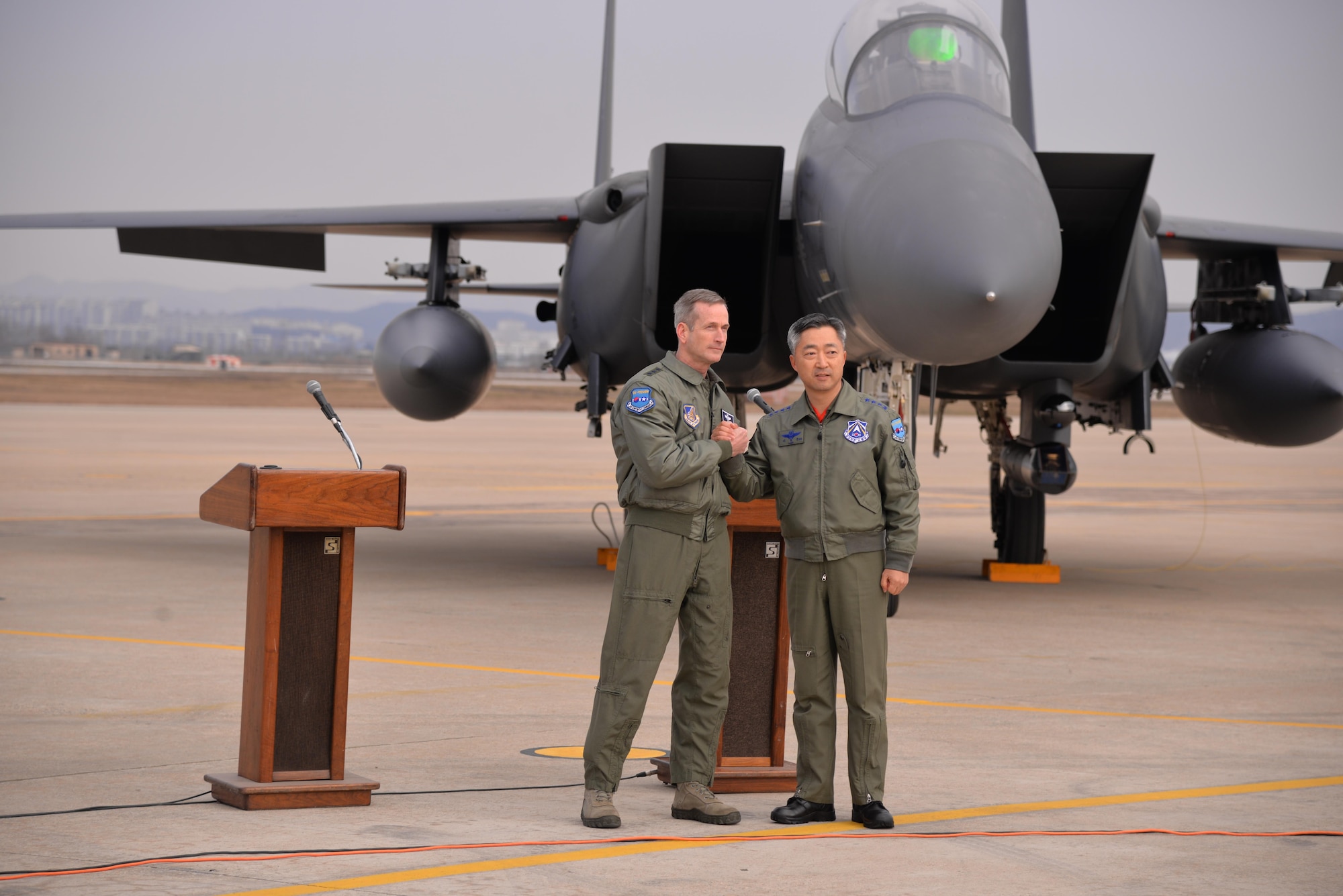 United Nations Command, U.S. Forces Korea deputy commander and U.S. 7th Air Force commander, Lt. Gen. Terrence O'Shaughnessy (right) and Lt. Gen. Wang-keon Lee, ROK Air Force Operations Command commander (left), speak to Korean and international media at Osan Air Base, South Korea, Jan. 10, 2016, prior to a low-level pass from a U.S. Air Force B-52 Stratofortress in response to recent provocative action by North Korea. The B-52 was joined by a ROKAF F-15 Slam Eagle and a U.S. Air Force F-16 Fighting Falcon. The B-52 is a is a long-range, heavy bomber that can fly up to 50,000 feet and has the capability to carry 70,000 pounds of nuclear or precision guided conventional ordnance with worldwide precision navigation capability. (U.S. Air Force photo/Staff Sgt. Benjamin Sutton)