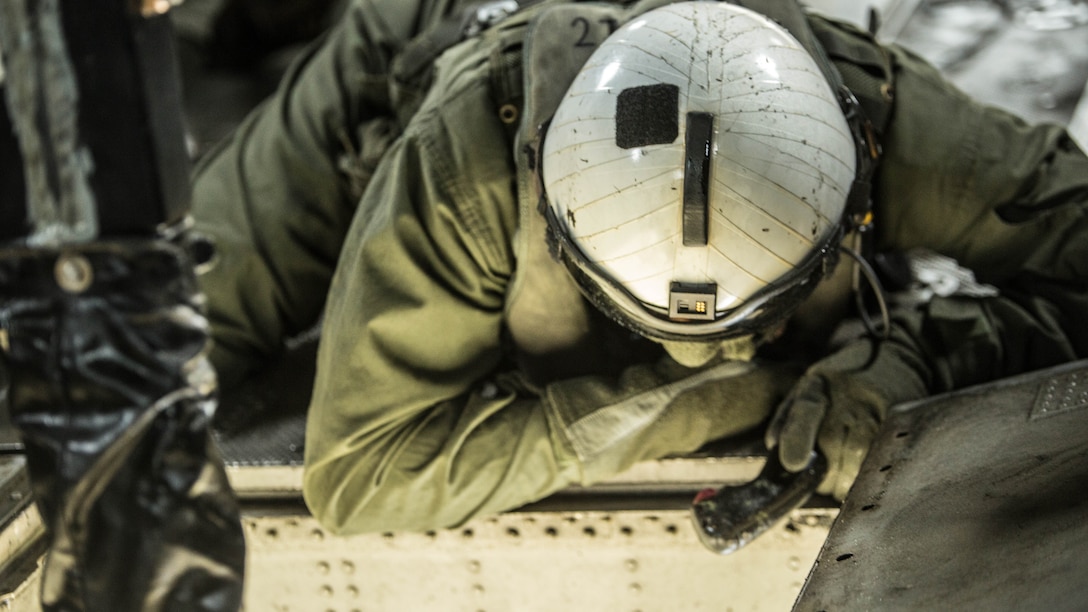 Lance Cpl. Jacob Burnette, a crew chief with Marine Heavy Helicopter Squadron 302, prepares to conduct external lifts in conjunction with Combat Logistics Battalion 2 at Marine Corps Base Camp Lejeune, N.C., Jan. 6, 2016. The crew chief’s responsibilities when conducting external lifts are to direct the pilot and co-pilot as they attach the load to the CH-53E Super Stallion allowing the pilot to solely focus on maneuvering the aircraft. 