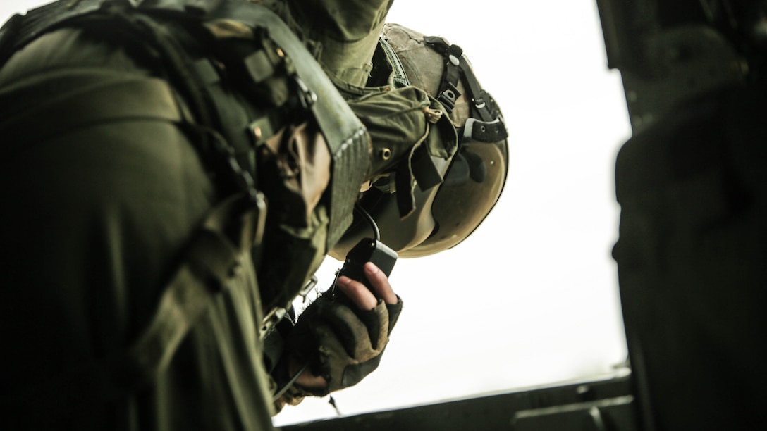 Cpl. Cody Vitols, a crew chief with Marine Heavy Helicopter Squadron 302, prepares to conduct external lifts in conjunction with Combat Logistics Battalion 2 at Marine Corps Base Camp Lejeune, N.C., Jan. 6, 2016. The crew chief’s responsibilities when conducting external lifts are to direct the pilot and co-pilot as they attach the load to the CH-53E Super Stallion allowing the pilot to solely focus on maneuvering the aircraft.