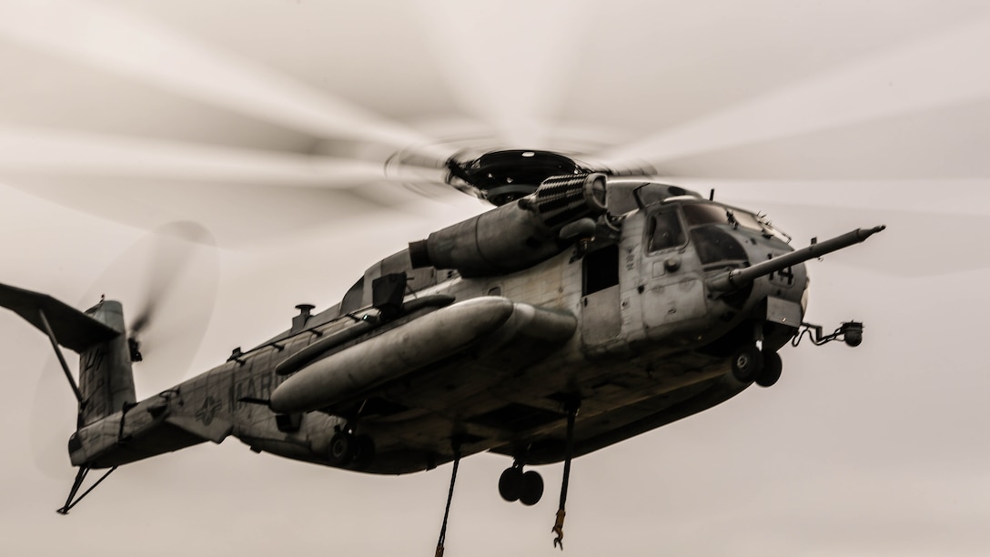 CH-53E Super Stallion hovers over the landing zone prior to conducting external lifts in conjunction with Combat Logistics Battalion 2 at Marine Corps Base Camp Lejeune, N.C., Jan. 6, 2016. The CH-53E is the go to aircraft in the Marine Corps for lifting heavy loads of cargo of up to 16 tons for 50 miles and back. 
