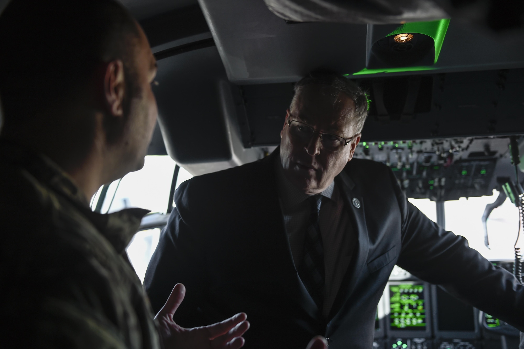 Deputy Secretary of Defense Bob Work speaks with Lt. Col. Brett Deangelis, commander of the 1st Special Operations Group Detachment 2, on the flight deck of an AC-130J Ghostrider at Hurlburt Field, Fla., Jan. 6, 2016. The deputy secretary of defense toured Air Force Special Operations Command aircraft static displays. (U.S. Air Force photo by Airman 1st Class Kai White)
