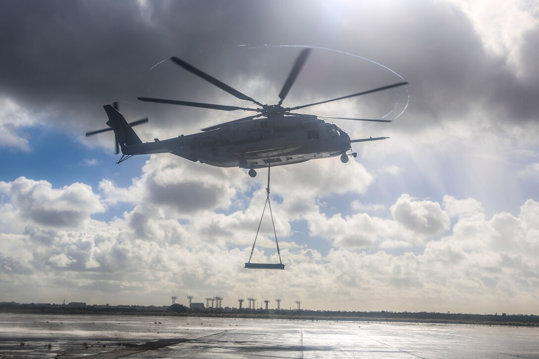 A CH-53E Super Stallion with Marine Heavy Helicopter Squadron (HMH) 465 carries a simulated cargo load of 6,200 pounds aboard Marine Corps Air Station Miramar, Calif., Jan. 7. Marines with HMH-465 and Combat Logistics Battalion (CLB) 11 practiced daytime external lift training to prepare for deliveries during deployments. (U.S. Marine Corps photo by Lance Cpl. Harley Robinson/Released) 