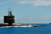 160107-N-PN275-020 DIEGO GARCIA, British Indian Ocean Territory (Jan. 7, 2016) Guided-missile submarine USS Florida (SSGN 728) pulls into Diego Garcia to moor alongside submarine tender USS Emory S. Land (AS 39). Emory S. Land is a forward deployed expeditionary submarine tender on an extended deployment conducting coordinated tended moorings and afloat maintenance in the U.S. 5th and 7th Fleet areas of operations. (U.S. Navy photo by Mass Communication Specialist 3rd Class Zachary A. Kreitzer/Released)