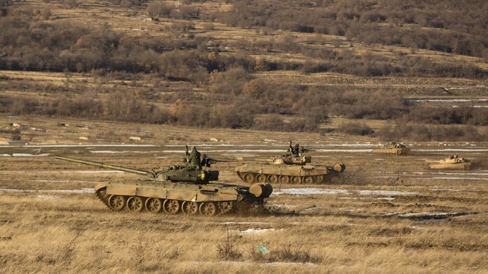 U.S. Marine M1A1 Abrams tanks and Bulgarian T-72 tanks conduct maneuver training during Platinum Lion 16-2 at Novo Selo Training Area, Bulgaria, Jan. 8, 2016. Exercise Platinum Lion provides combined training with NATO Allies and partners, demonstrating our commitment to promoting a peaceful and stable Europe through theatre security cooperation engagements. 