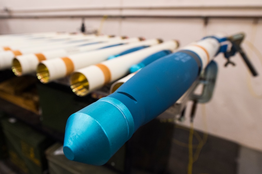 A fully assembled, 2.75-inch signature practice rocket rests on a stabilizer during a rocket build, Jan. 7, 2016, at Moody Air Force Base, Ga. On average, members of the 23d Equipment Maintenance Squadron munitions flight build between 1,800 and 2,000 practice rockets annually. (U.S. Air Force photo by Senior Airman Ceaira Tinsley/Released)