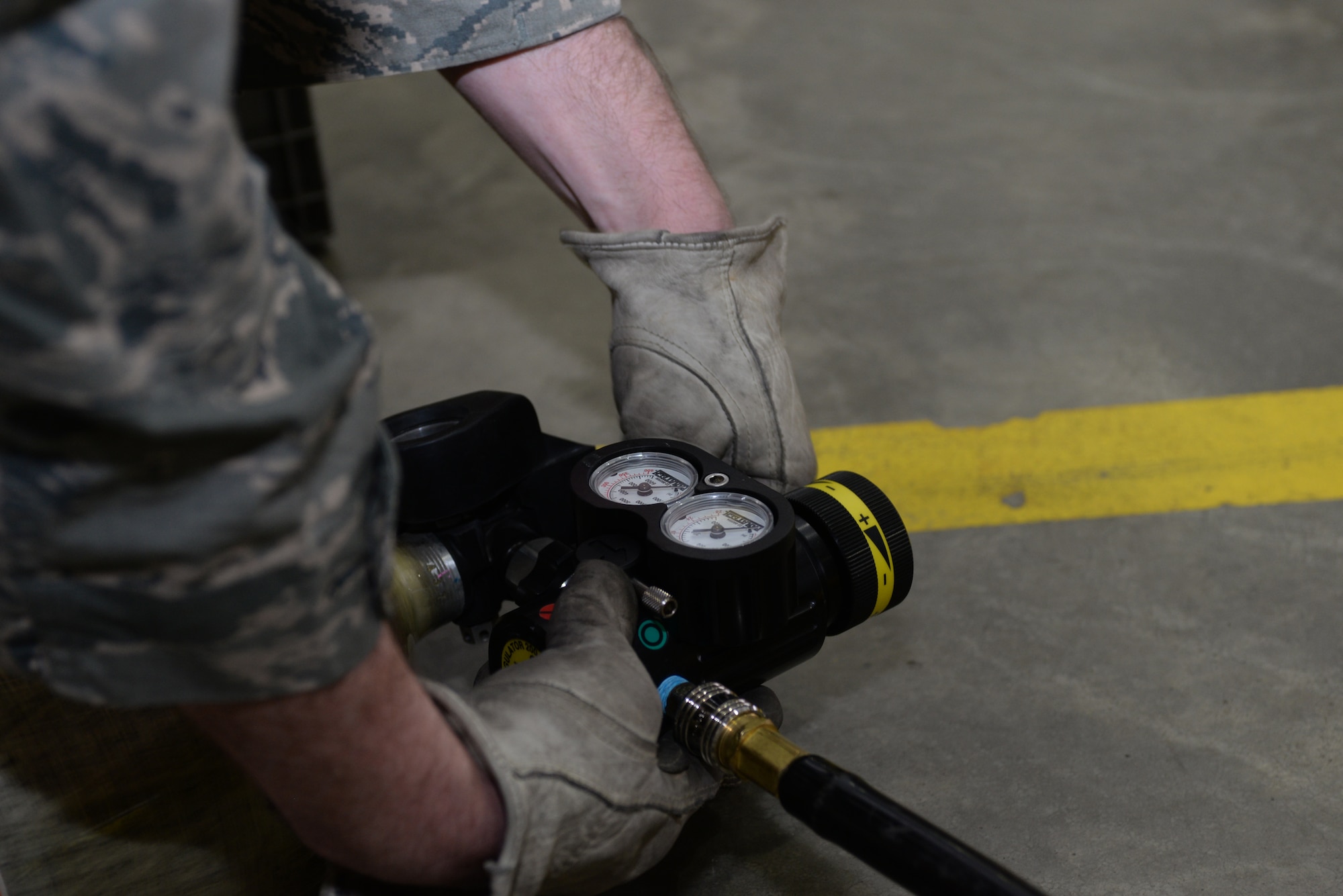 Senior Airman Levi Hickey, 28th Civil Engineer Squadron fire protection flight driver operator, prepares to deflate the supportable water bridge at Ellsworth Air Force Base, S.D., Jan. 7, 2016. The fire department received new equipment to be deployed during water rescue missions and will begin in-depth training when base lakes thaw. (U.S. Air Force photo by Airman Donald C. Knechtel/Released)