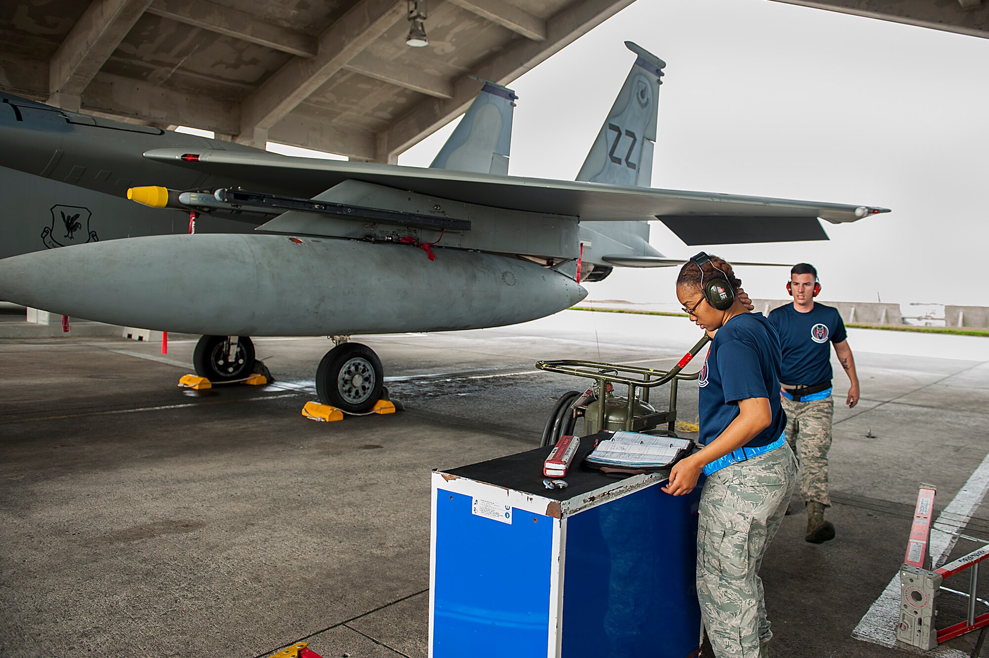 U.S. Air Force Senior Airman Dominique Hursey, 18th Aircraft Maintenance Squadron weapons load crew member, checks her work during a weapons load competition Jan. 8, 2016, at Kadena Air Base, Japan. The weapons load competition is held quarterly with each winning team able to compete in the yearly weapons load competition. (U.S. Air Force photo by Airman 1st Class Corey M. Pettis)