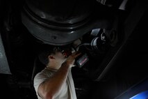 Senior Airman Andrew Kirk, 22nd Logistics Readiness Squadron vehicle maintainer, removes a broken part from a vehicle Jan. 8, 2016, at McConnell Air Force Base, Kan. Vehicle Maintainers upkeep the vehicle fleet by replacing broken parts ensures the operator is safe during the performance of the mission. (U.S. Air Force photo/Airman Jenna K. Caldwell)