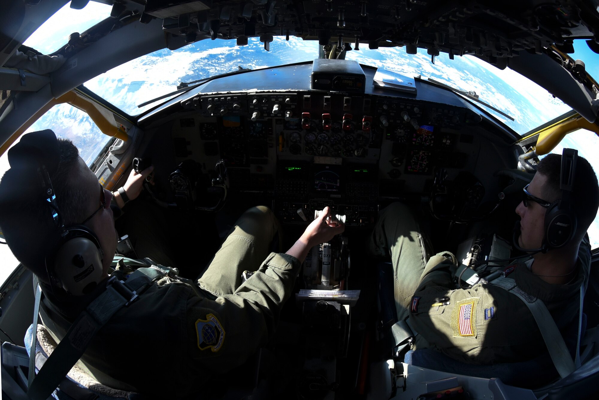 Col. Matthew Fritz, 92nd Air Refueling Wing vice commander and pilot, and Capt. Robert Delabar, 92nd Air Refueling Squadron instructor pilot, control the KC-135 Stratotanker from the cockpit during a Spokane-area Media Orientation Flight Jan. 8, 2016 over Ore. The orientation flight gave the media an opportunity to witness six F-15 Eagles from Kingsley Field Air National Guard Base, Ore. and one C-17 Globemaster III from Joint Base Lewis-McChord, Wash., being refueled by a KC-135 Stratotanker from Fairchild Air Force Base, Wash. (U.S. Air Force photo/ Senior Airman Janelle Patiño)